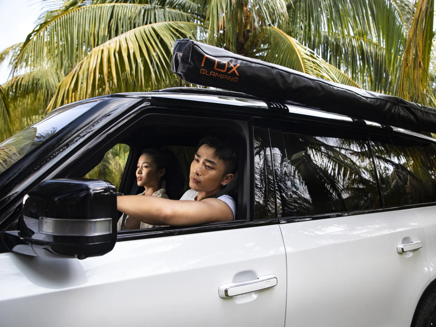 ROX 01 manufacturer lifestyle scene with a roof-mounted ROX glamping accessory